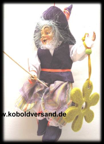 Hexe mit liebem Gesicht Blümchen